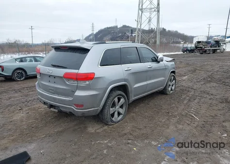 2014 Jeep Grand Cherokee Overland z USA, uszkodzony, nr VIN 1C4RJFCG6EC402398
